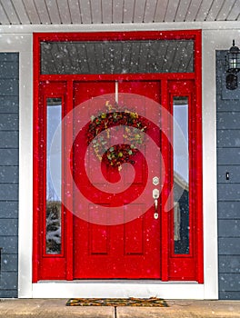 Festive front door on a snowy day in Daybreak Utah