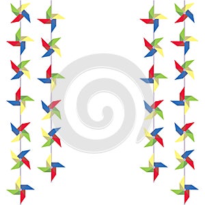Festive garland of colored paper pinwheels. Vertical festive garland of pinwheels. Bright garland for decoration.