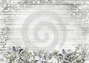 Festive garland with snow-covered Christmas tree branches on a white wooden background