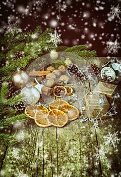 Festive Gifts with Boxes, Cinnamon Sticks, Dried Oranges, Baubles, Cones, Walnuts.