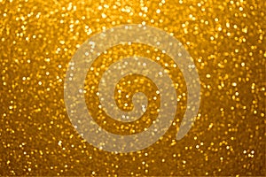 Festive golden bokeh background with sparkling glitter
