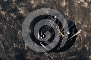 Festive Halloween table setting in a black style. Plate with fork, spoon and knife on a linen napkin. Halloween dinner. Minimal