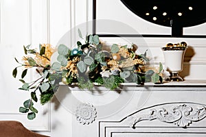 Festive Holiday Mantelpiece with Ornamental Greenery