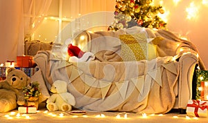 Festive Home interior - wew year or christmas decoration. At night, the room glows with festive lights. A lots of gifts and