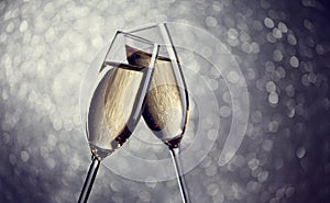 Festive image of two wine glasses with sparkling champagne