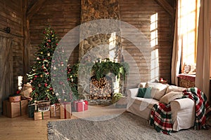 Festive interior with Christmas tree and fireplace