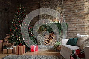 Festive interior with Christmas tree and fireplace