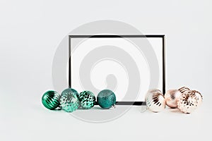 Festive layout. black frame with blank white background for text. christmas decor turquoise and gold, minimalistic composition
