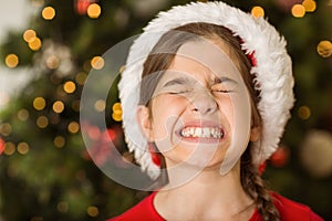 Festive little girl scrunching up her face