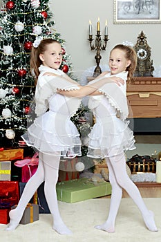 Festive little girls hugging.