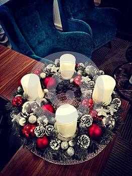 Christmas wreath with candles in the living room.