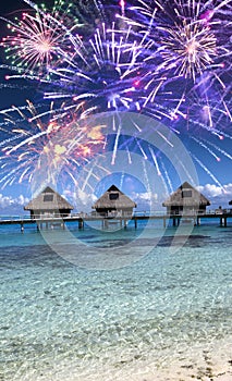 Festive New Years fireworks over the tropical island, mixed media