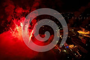 Festive night fireworks in the sky above the old city. Shooting from a drone. PoreÄ. Croatia.