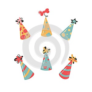 Festive party caps for your birthday. Set of vector illustrations with .cones. Cute hats with buboes. Isolated on a photo