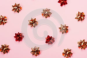 Festive pastel pink background with glossy starbows.