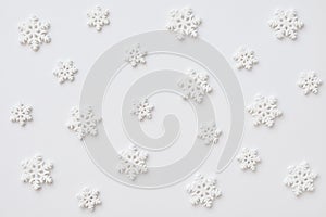 Festive pattern made of snowflakes on white background. Winter, Christmas, New Year concept