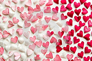 festive pattern of pink and red hearts on a white background