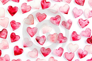 festive pattern of pink and red hearts on a white background