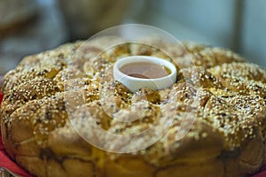 A festive pie with honey and sesame served during Christian holidays, such as wedding, baptism, birthday and christmas.