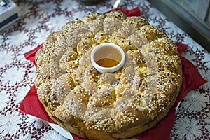 A festive pie with honey and sesame served during Christian holidays, such as wedding, baptism, birthday and christmas.