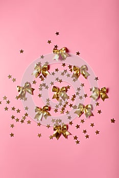 Festive pinky background with golden stars and glitter