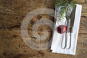 Festive place setting for Christmas holiday dinner. Vintage background, copy space