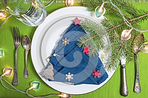 Festive place setting for Christmas or New Year dinner.