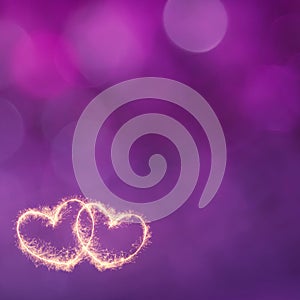 Festive Purple background with glowing gold hearts