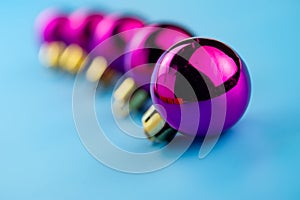 Festive purple balls on a blue background