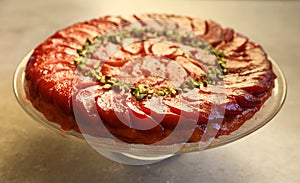 Festive Quince tart tatin, beautiful and delicious  dessert for the Holidays, garnished with green pistachios