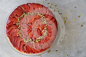 Festive Quince tart tatin, beautiful and delicious  dessert for the Holidays, garnished with green pistachios