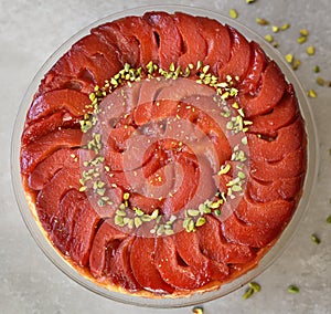 Festive Quince tart tatin, beautiful and delicious  dessert for the Holidays, garnished with green pistachios