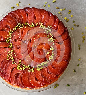 Festive Quince tart tatin, beautiful and delicious  dessert for the Holidays, garnished with green pistachios