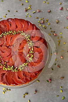 Festive Quince tart tatin, beautiful and delicious  dessert for the Holidays, garnished with green pistachios