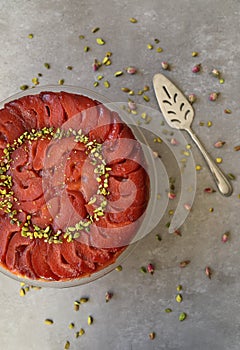 Festive Quince tart tatin, beautiful and delicious  dessert for the Holidays, garnished with green pistachios