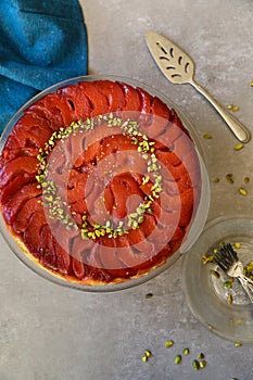 Festive Quince tart tatin, beautiful and delicious  dessert for the Holidays, garnished with green pistachios