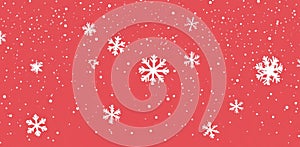 Festive red background with detailed white snowflakes and falling snowflakes for Christmas decorations photo