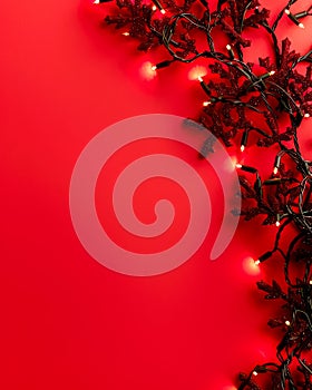 Festive Red Background with Glowing Christmas Lights and Decorative Branches for Holiday Design