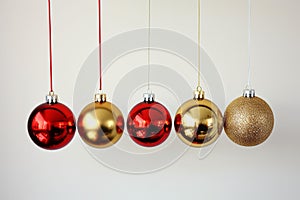Festive Reflections: Vibrant Red and Gold Christmas Ornaments on Silver Branch