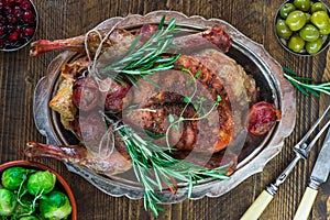 Festive roast duck on wooden table