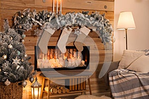 Festive room interior with fireplace and Christmas stockings