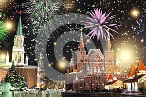 Festive salute and fireworks on the red square in Moscow. Salute lights over the Kremlin and GUM at the New Year celebration