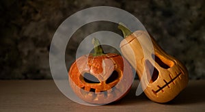 Festive scary halloween pumpkins on wooden table