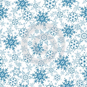 Festive seamless pattern with blue snowflakes