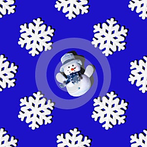 Festive seamless pattern white snowflakes and snowman on a blue background, square layout, top view