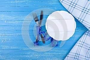 Festive set of cutlery knife and fork with a white dessert plate