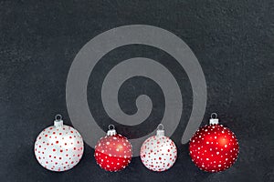 Festive set of white and red  new year toys balls on black background. Christmas banner, winter decoration