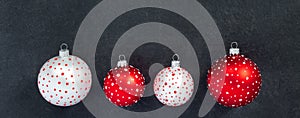 Festive set of white and red  new year toys balls on black background. Christmas banner, winter decoration