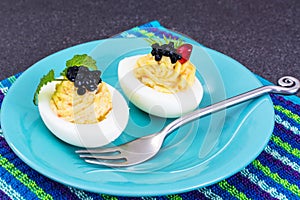 Festive snack stuffed eggs