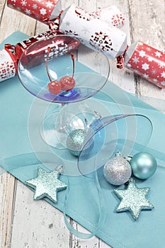 Festive spirit blue martini cocktail glasses w' Christmas decorations